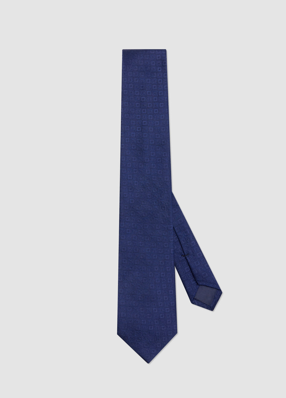 Corbata azul con diseño cuadrado tono –